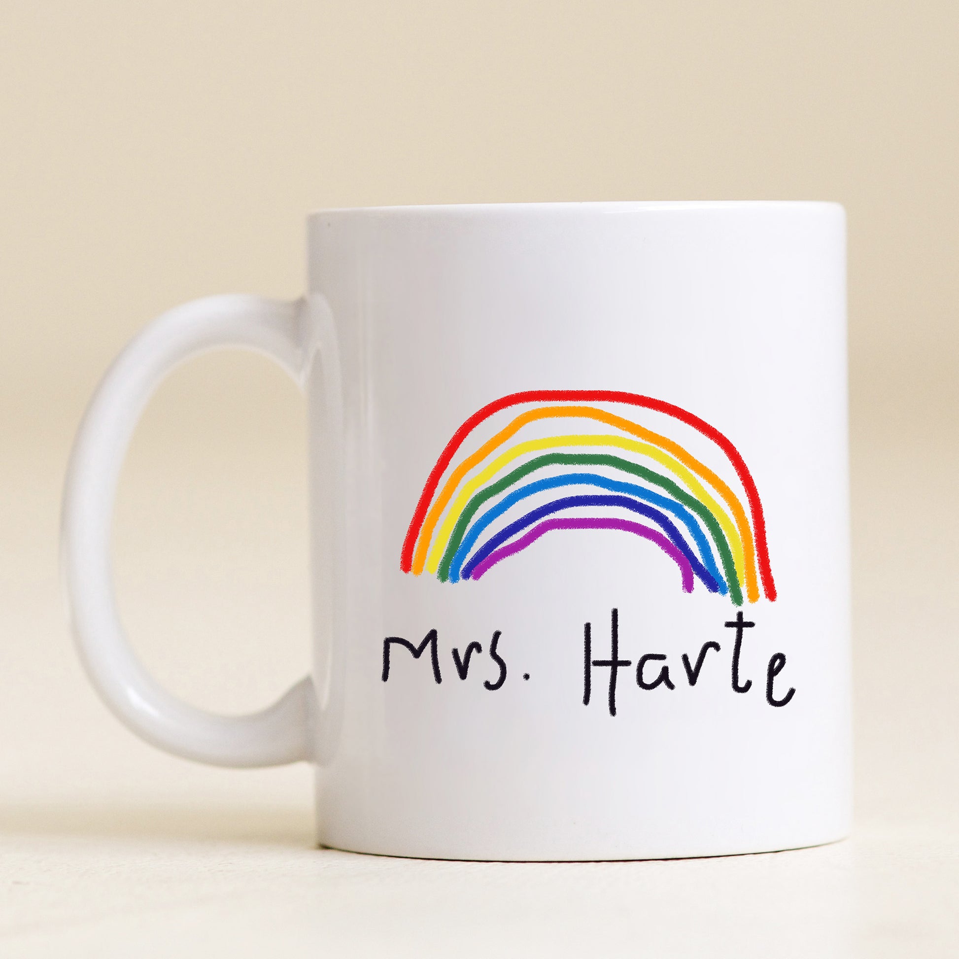 White mug with a rainbow and 'Mrs. Harte' text on a beige background | Little Heirloom