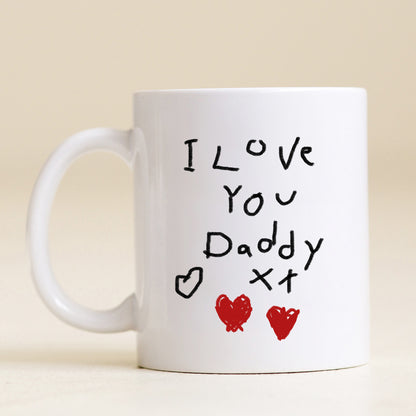 White mug with 'I Love You Daddy' text and heart designs on a beige background | Little Heirloom