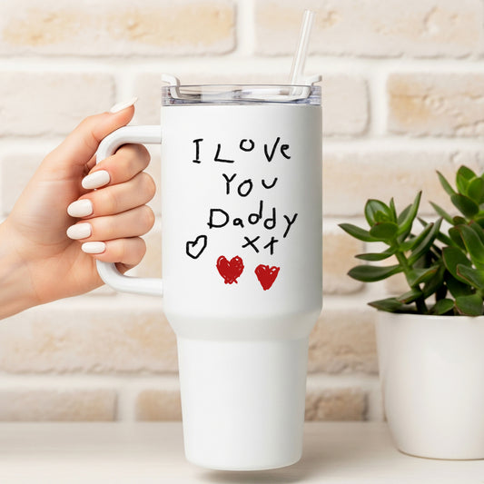 White mug with 'I Love You Daddy' text held by a hand, against a light brick wall. | Little Heirloom