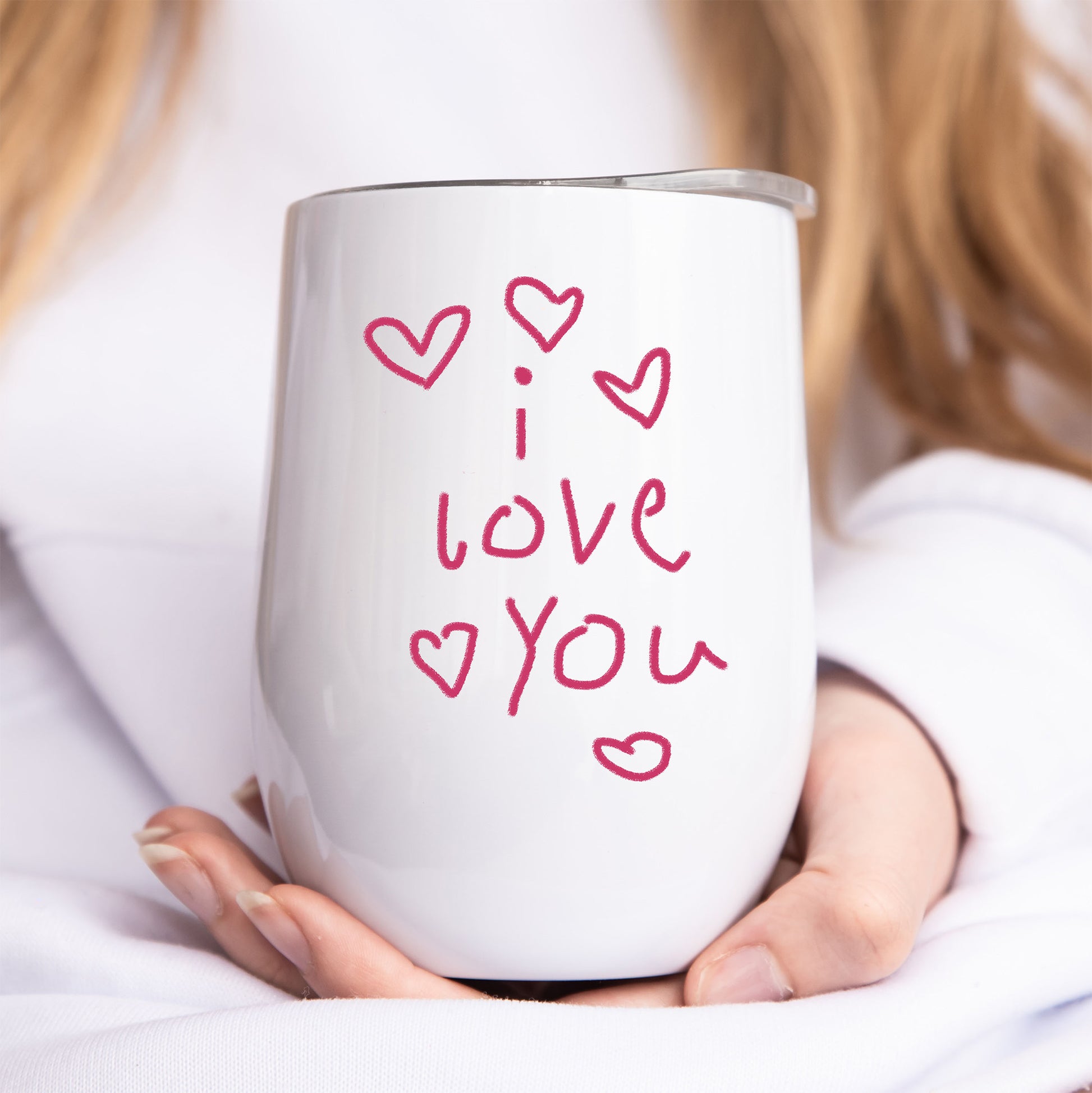 White tumbler with 'I love you' text and hearts held by a person | Little Heirloom