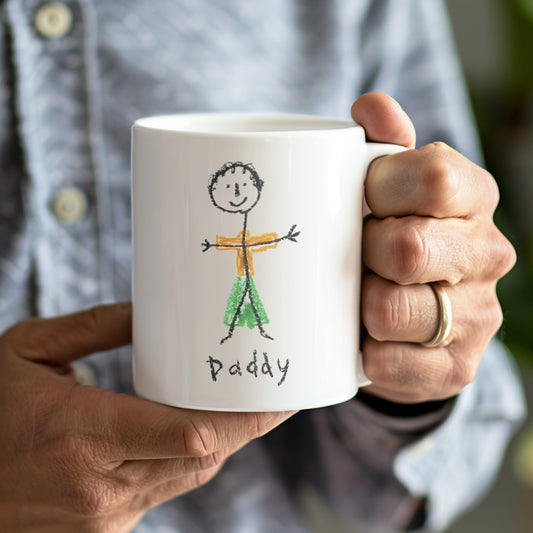Person holding a white mug with a stick figure drawing labeled 'Daddy' and text. | GIFTS FOR DAD | Little Heirloom
