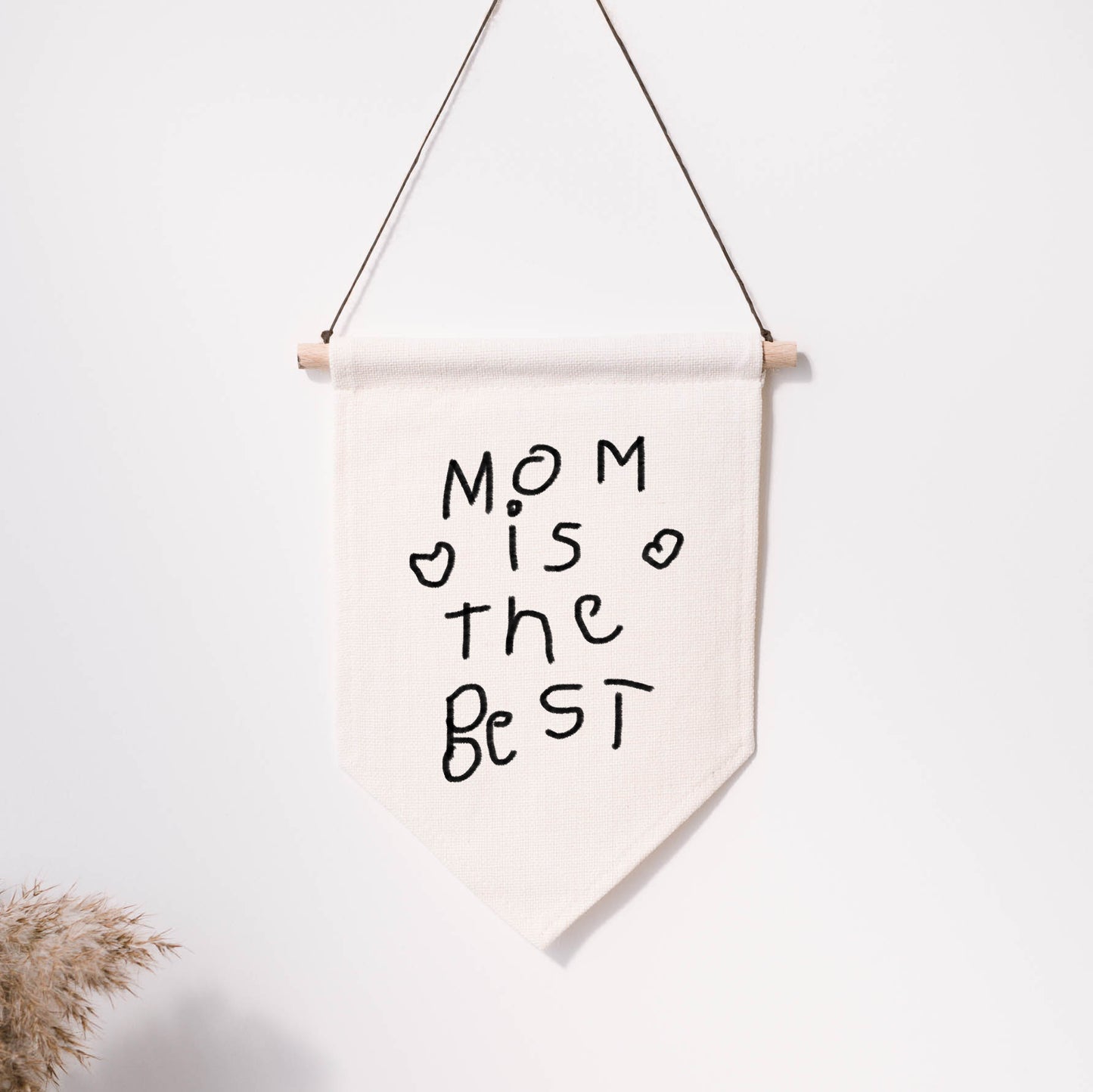 Canvas banner with 'Mom is the best' text on a white background | Little Heirloom
