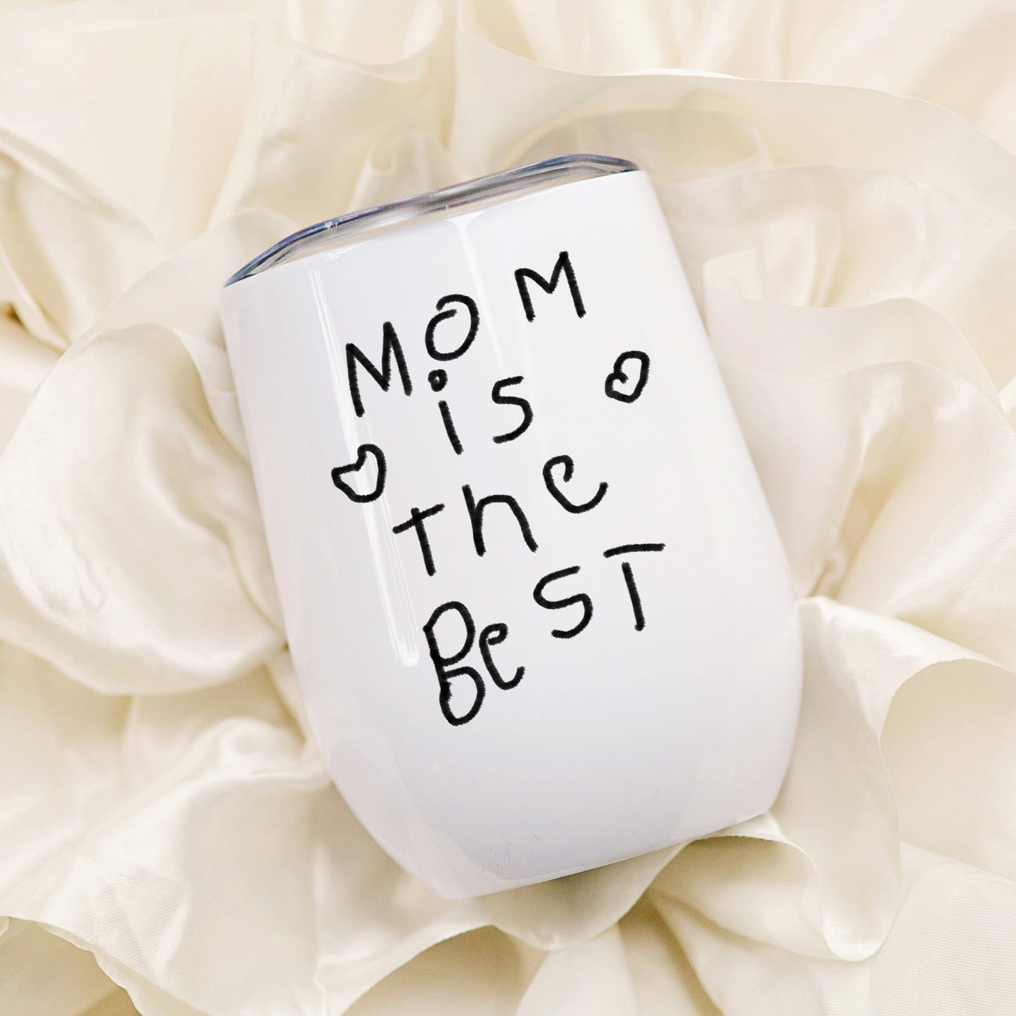 White tumbler with 'Mom is the best' text on a soft beige background | Little Heirloom