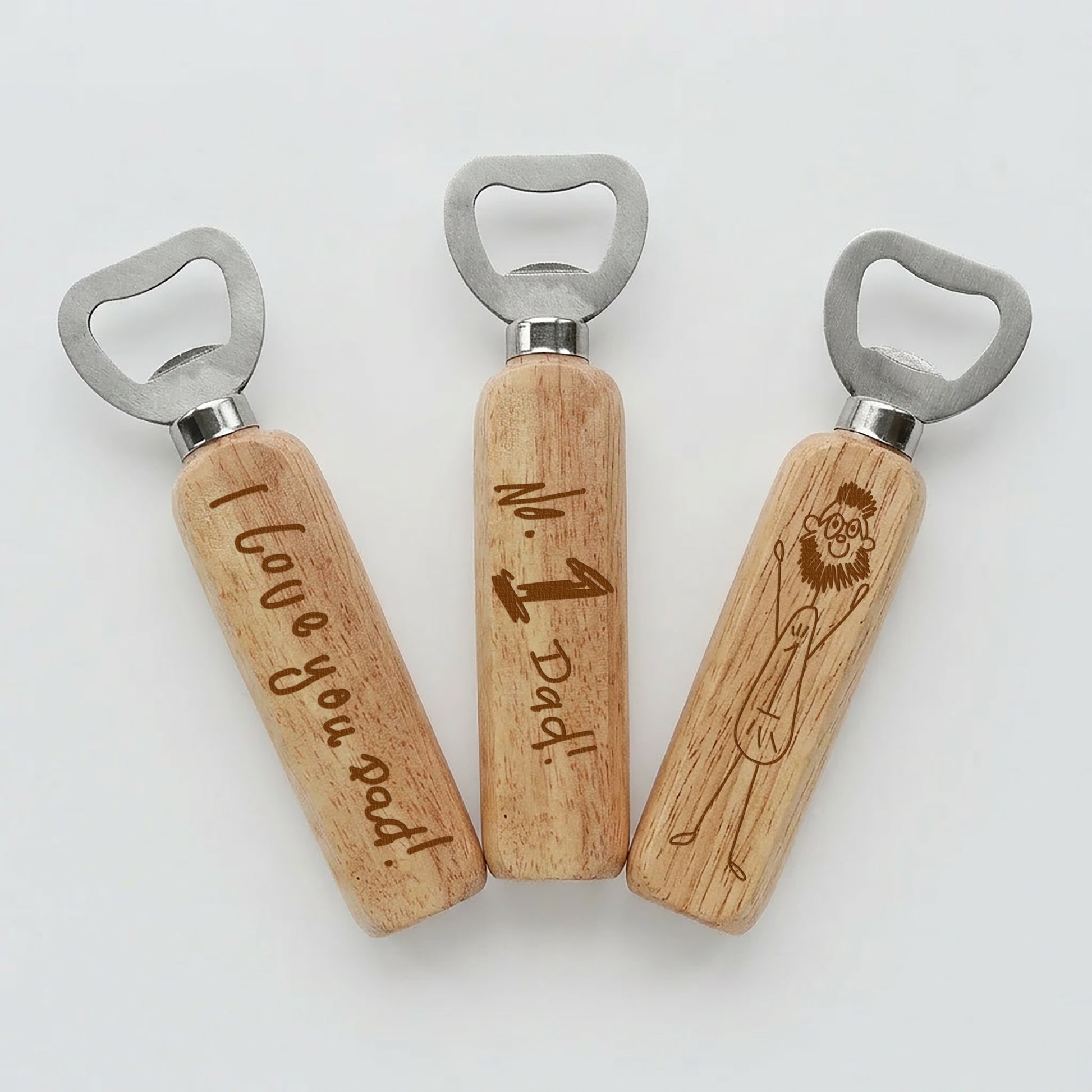 Three wooden bottle openers with engraved with children's writing on a white background | Little Heirloom