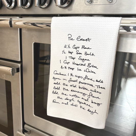 Handwritten recipe on a towel hanging on a stove  | Little Heirloom