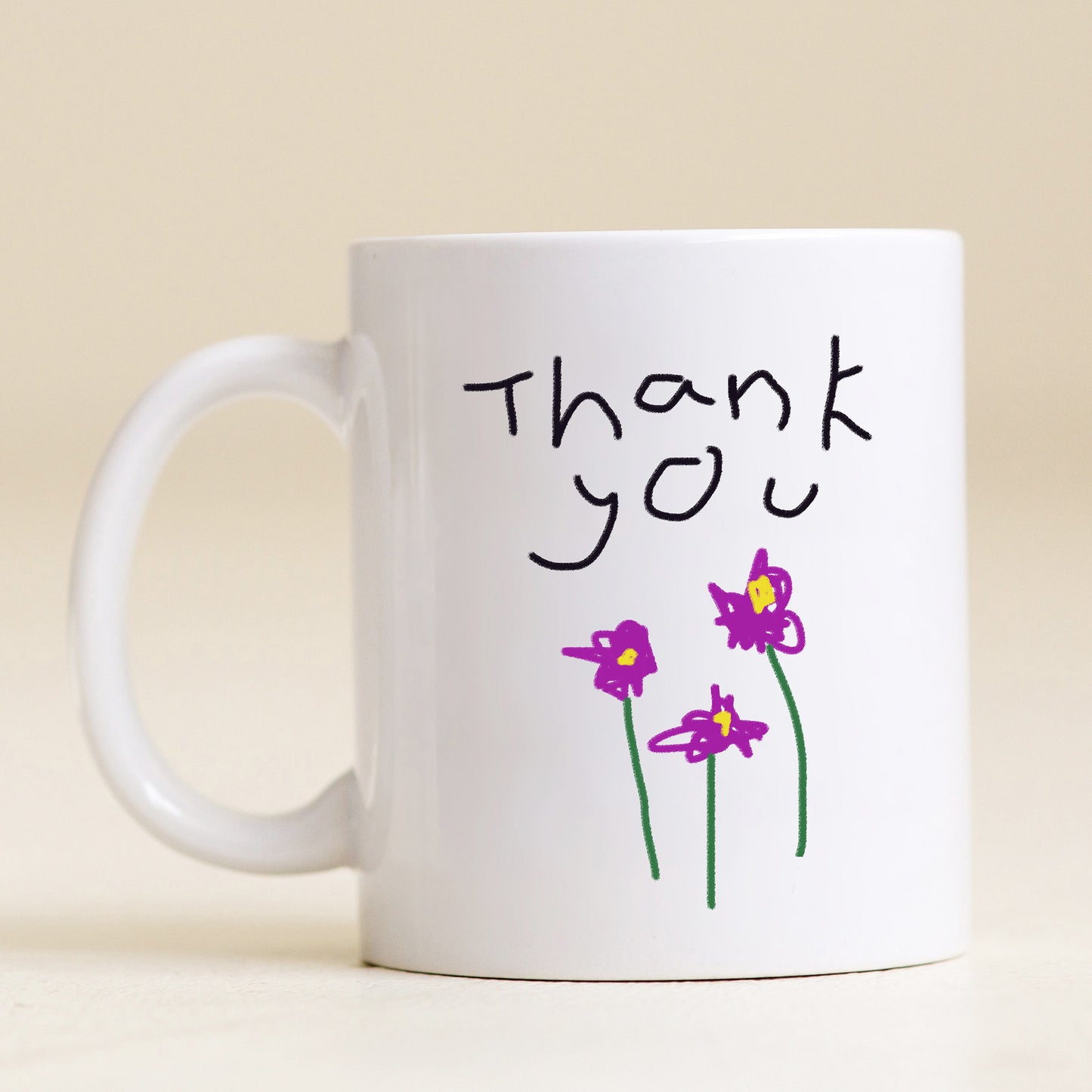 White mug with 'Thank you' and flower drawings on a beige background | Little Heirloom